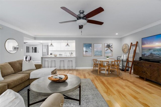 3140 Sumatra Pl, Costa Mesa, CA 92626 - living room with ornamental molding, ceiling fan, light wood finished floors, recessed lighting, and baseboards