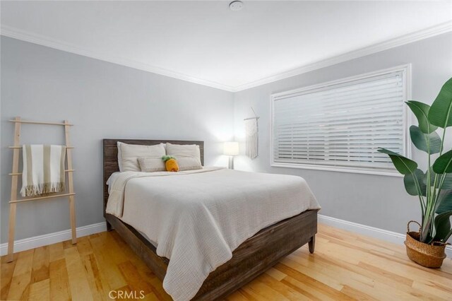 3140 Sumatra Pl, Costa Mesa, CA 92626 - bedroom featuring wood finished floors, baseboards, and crown molding