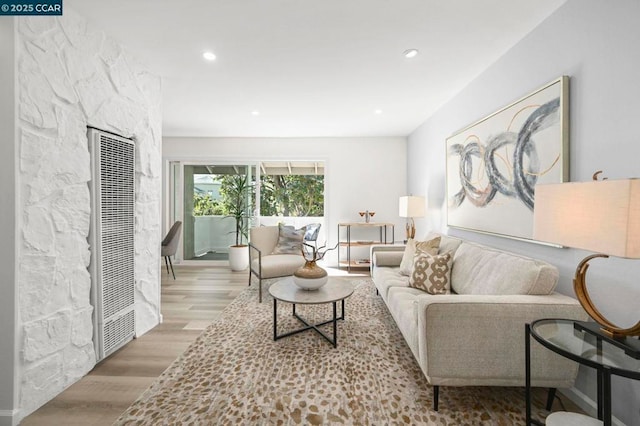 living room with light hardwood / wood-style flooring