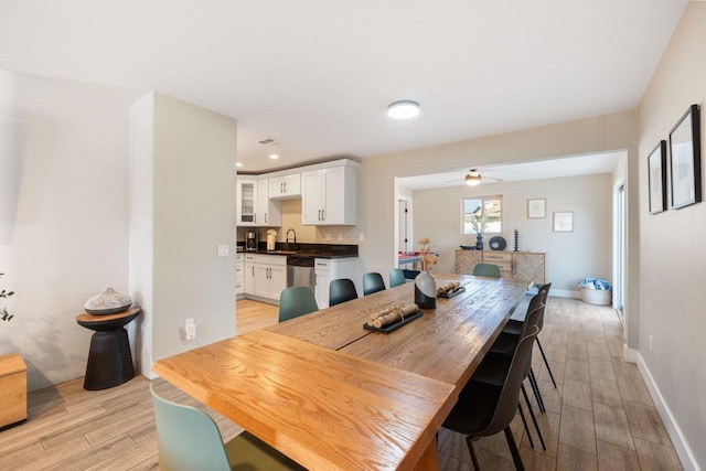 dining area featuring light hardwood / wood-style floors and sink