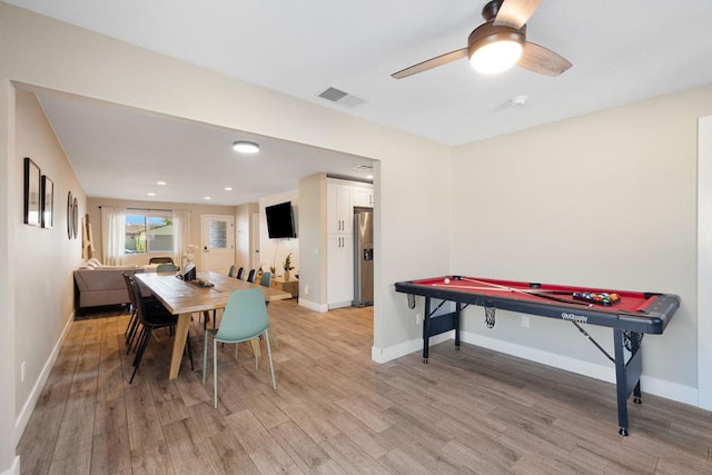 dining space with ceiling fan, pool table, and light hardwood / wood-style flooring