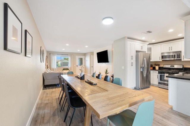 dining room with light hardwood / wood-style floors