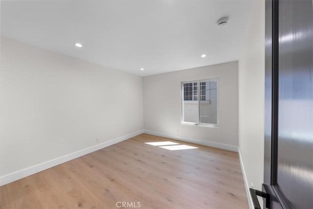 unfurnished room featuring light hardwood / wood-style floors