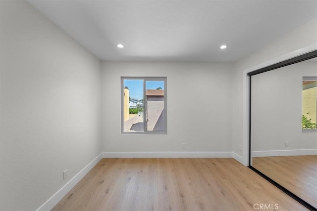 unfurnished bedroom with light hardwood / wood-style floors