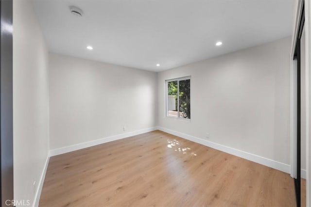 spare room with light hardwood / wood-style floors