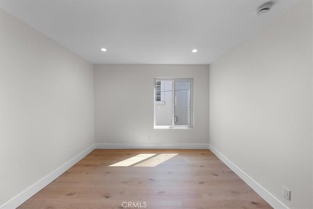 spare room featuring light hardwood / wood-style floors