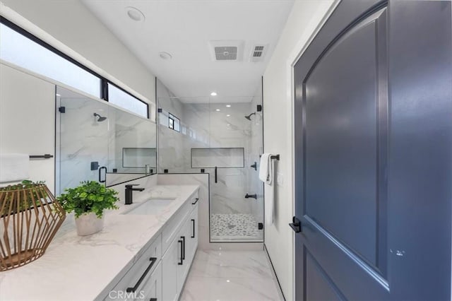 bathroom with vanity and an enclosed shower