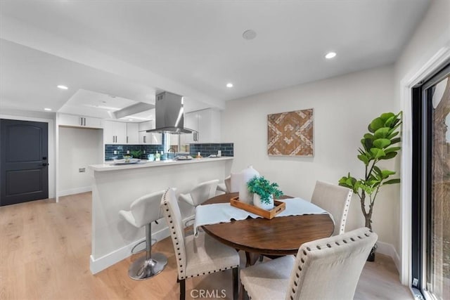 dining room featuring light hardwood / wood-style flooring