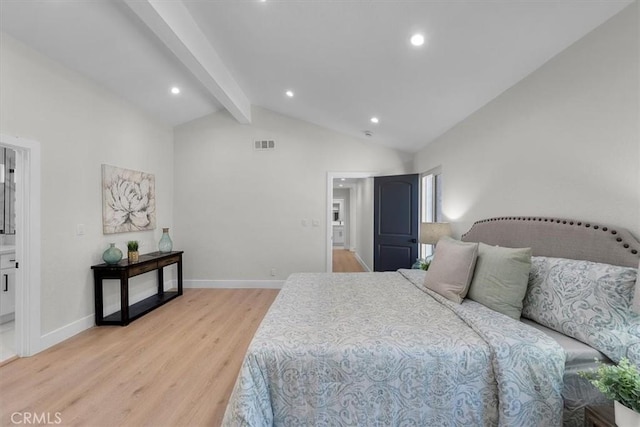 bedroom with lofted ceiling with beams and light hardwood / wood-style flooring