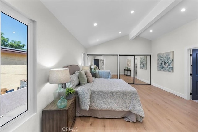 bedroom featuring lofted ceiling with beams and light wood-type flooring