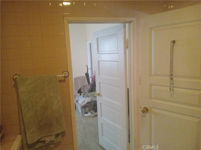 bathroom with tile patterned floors