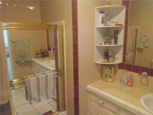 bathroom featuring tile patterned flooring and sink