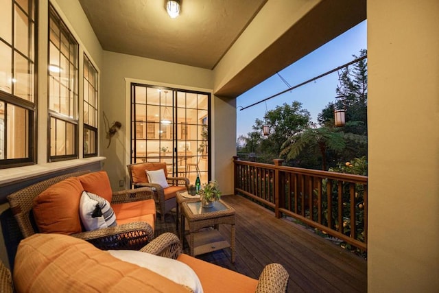 balcony at dusk with outdoor lounge area