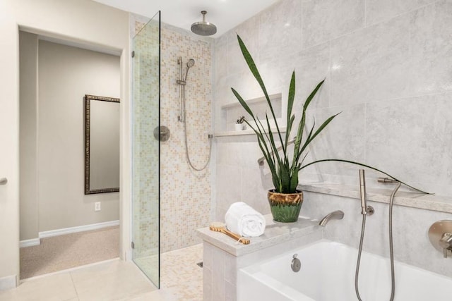 bathroom with tiled shower and tile patterned floors