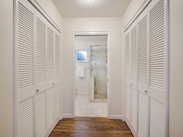 corridor with dark hardwood / wood-style floors