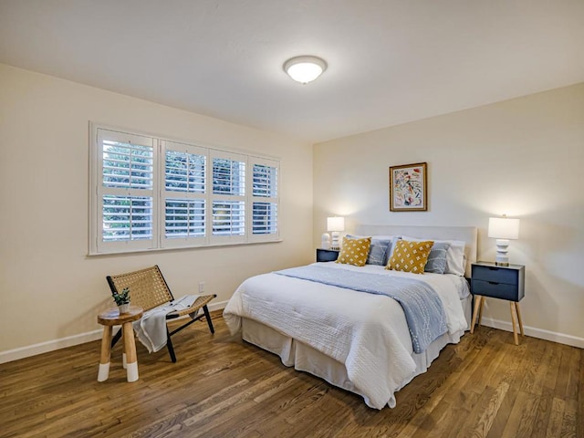 bedroom with hardwood / wood-style flooring