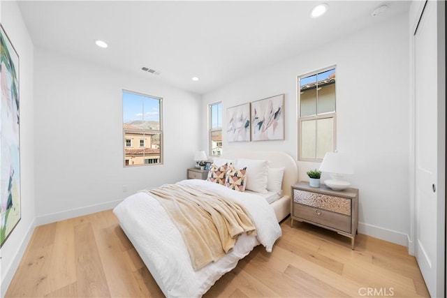 bedroom with light hardwood / wood-style floors