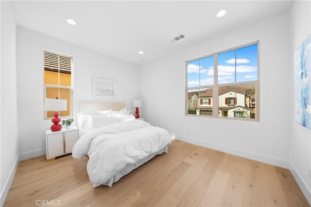 bedroom with light wood-type flooring