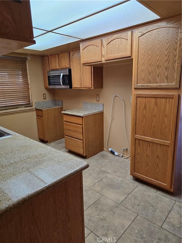 kitchen with light tile patterned floors