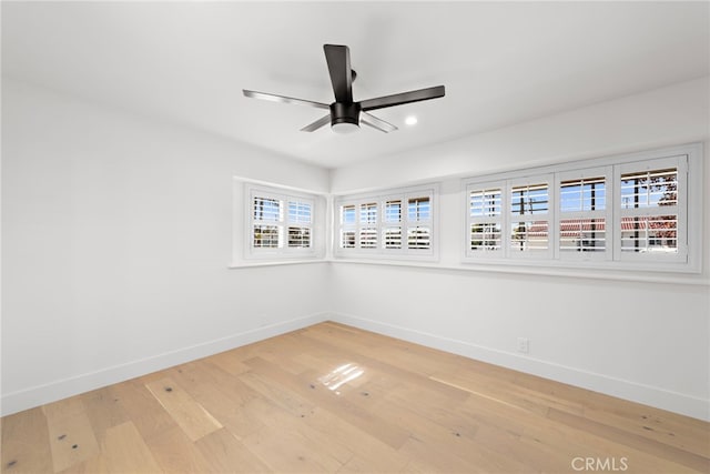 unfurnished room featuring ceiling fan and wood-type flooring