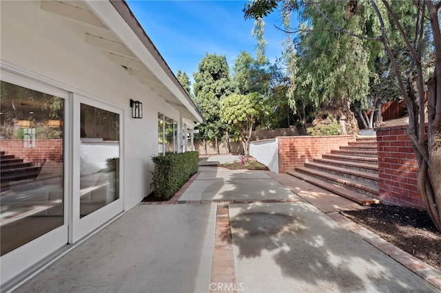 view of home's exterior with a patio