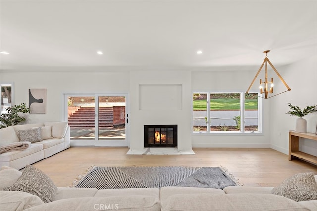 living room featuring hardwood / wood-style floors and a chandelier