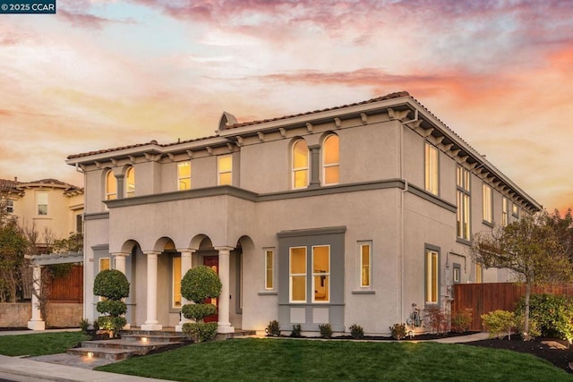 view of front of home with a lawn