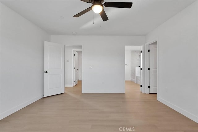 unfurnished bedroom featuring light wood finished floors, baseboards, and ceiling fan