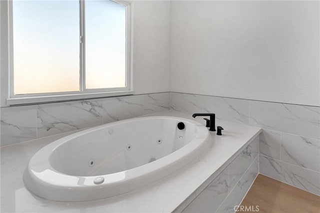 bathroom featuring a whirlpool tub