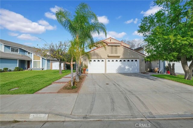 view of front facade with a garage and a front yard