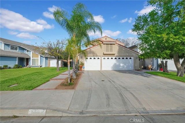 view of front of property featuring a garage and a front yard