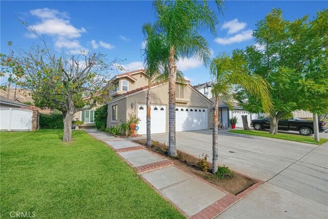 view of front of property with a garage and a front yard