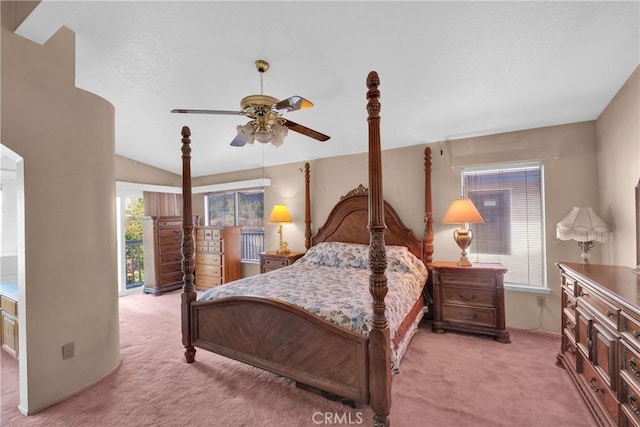 carpeted bedroom featuring vaulted ceiling and ceiling fan