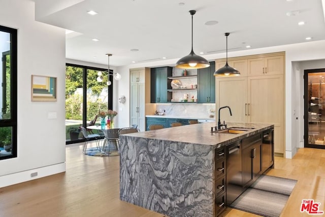 bar featuring pendant lighting, sink, black dishwasher, light hardwood / wood-style floors, and light brown cabinets