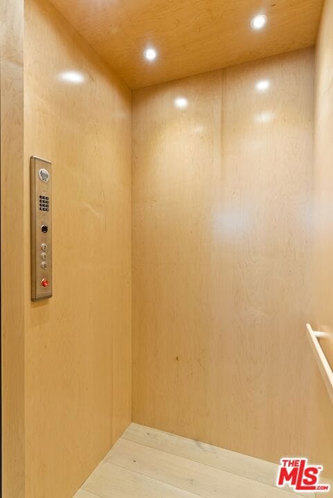 spare room featuring wooden ceiling and elevator