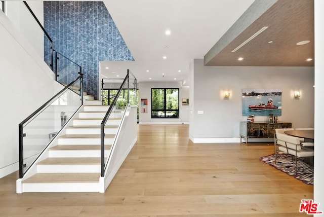 foyer entrance with light hardwood / wood-style floors