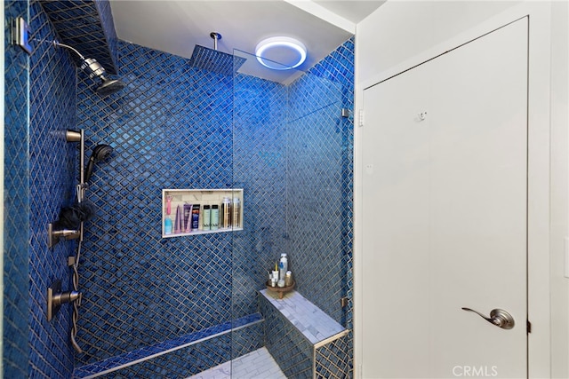 bathroom with a tile shower