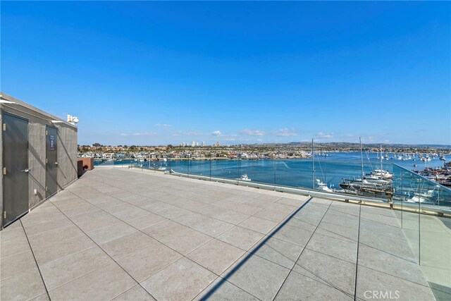 view of swimming pool featuring a water view