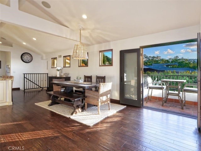 dining space featuring lofted ceiling, dark hardwood / wood-style floors, and plenty of natural light