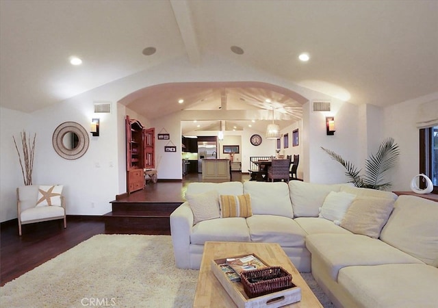 living room featuring lofted ceiling with beams and hardwood / wood-style floors