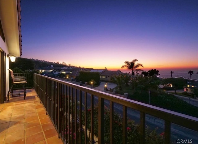 balcony at dusk with a water view