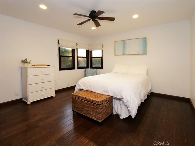 bedroom with dark wood-type flooring and ceiling fan