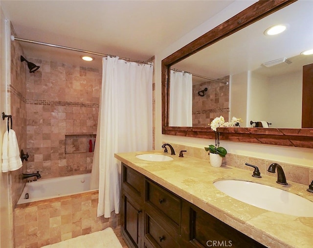 bathroom featuring vanity and shower / tub combo