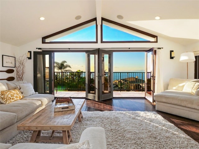 living room with lofted ceiling with beams and dark hardwood / wood-style floors