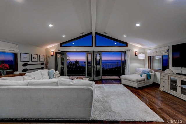 living room featuring dark wood-type flooring and lofted ceiling with beams