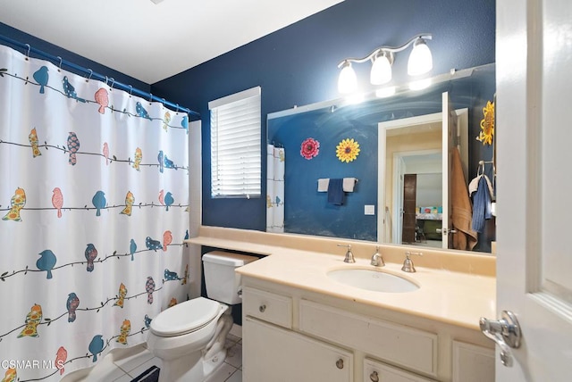 bathroom with a shower with curtain, vanity, tile patterned floors, and toilet