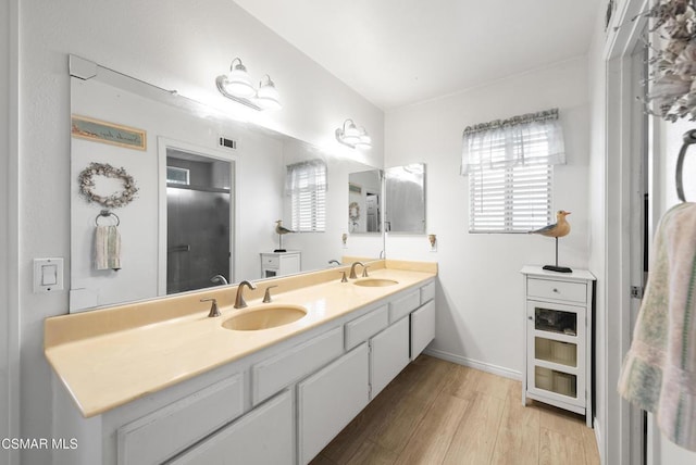 bathroom featuring vanity and wood-type flooring