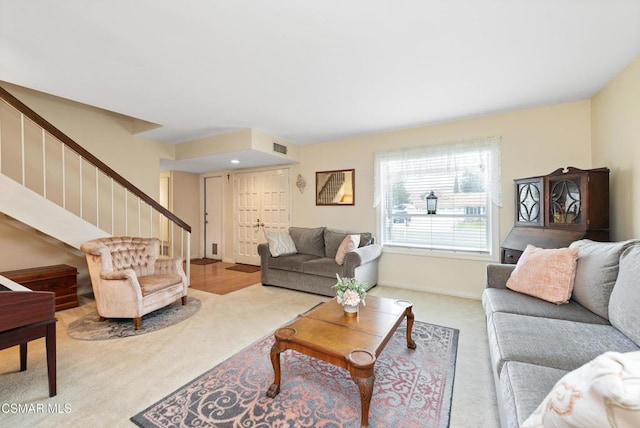 living room featuring light carpet