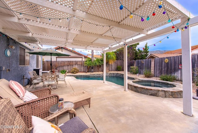 view of patio with a pool with hot tub