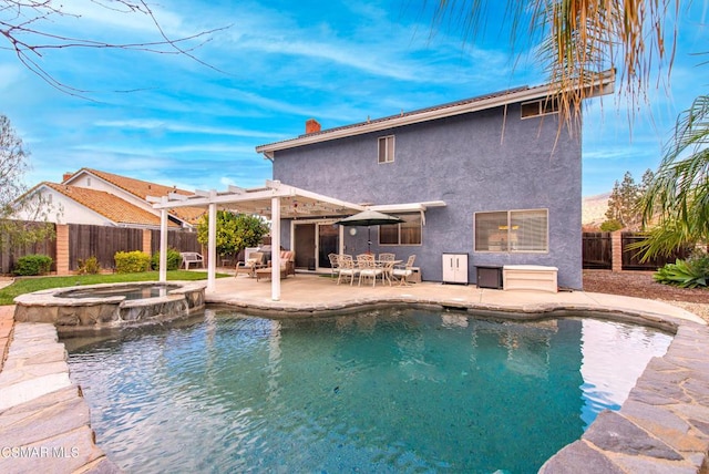 view of swimming pool with an in ground hot tub and a patio